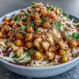 Wholesome Peanut Chickpea Protein Bowl served in a bowl with vibrant veggies, crunchy peanuts, and aromatic cilantro garnish.  