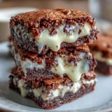 Irresistible fudgy brownie cookies with a hidden cream cheese center, baked to gooey perfection.
