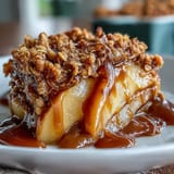Whiskey caramel apple crisp with bubbly filling and golden oat topping.