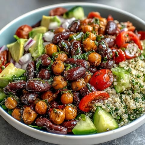 Colorful Three-Bean Power Bowl featuring quinoa, avocado, and crisp greens for a wholesome lunch.  