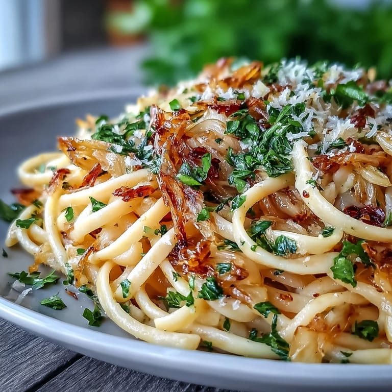 Hearty skillet of Cabbage Pasta With Garlic and Parmesan featuring tender cabbage strands, melted cheese, and toasted breadcrumbs for extra crunch.