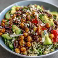 Three-Bean Power Bowl with fresh vegetables and zesty lemon dressing, a vibrant and nourishing meal.  